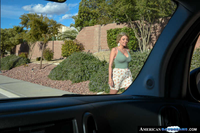 Naughty America Kayla Kayden porn: Kayla Kayden is standing outside of a car.