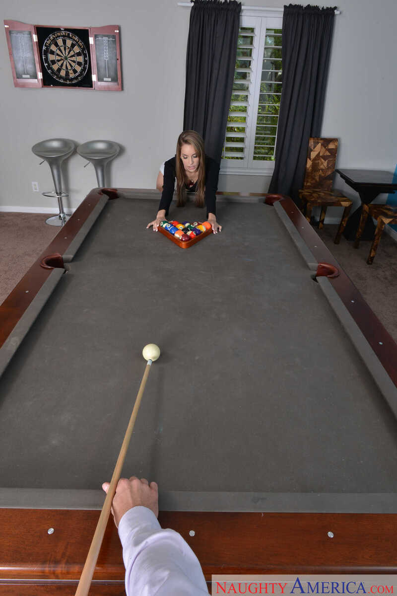 Naughty America Kimmy Granger porn: Kimmy Granger is playing pool in a room with a dartboard.