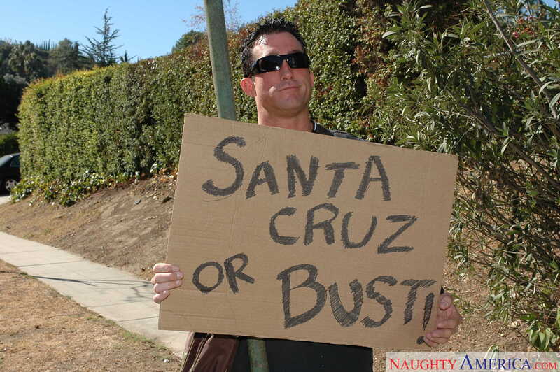 In the Lexi Belle Naughty America porn scene 'Lexi Belle gets fucked by a big cock' from American Daydreams, Lexi Belle is holding a sign that says Santa Cruz or Bust.