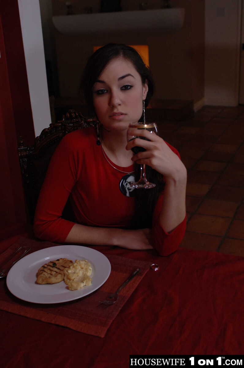 In the Sasha Grey Housewife 1 on 1 porn scene 'Sasha Grey fucks her husband', Sasha Grey is posing with a plate of food and a glass of wine.