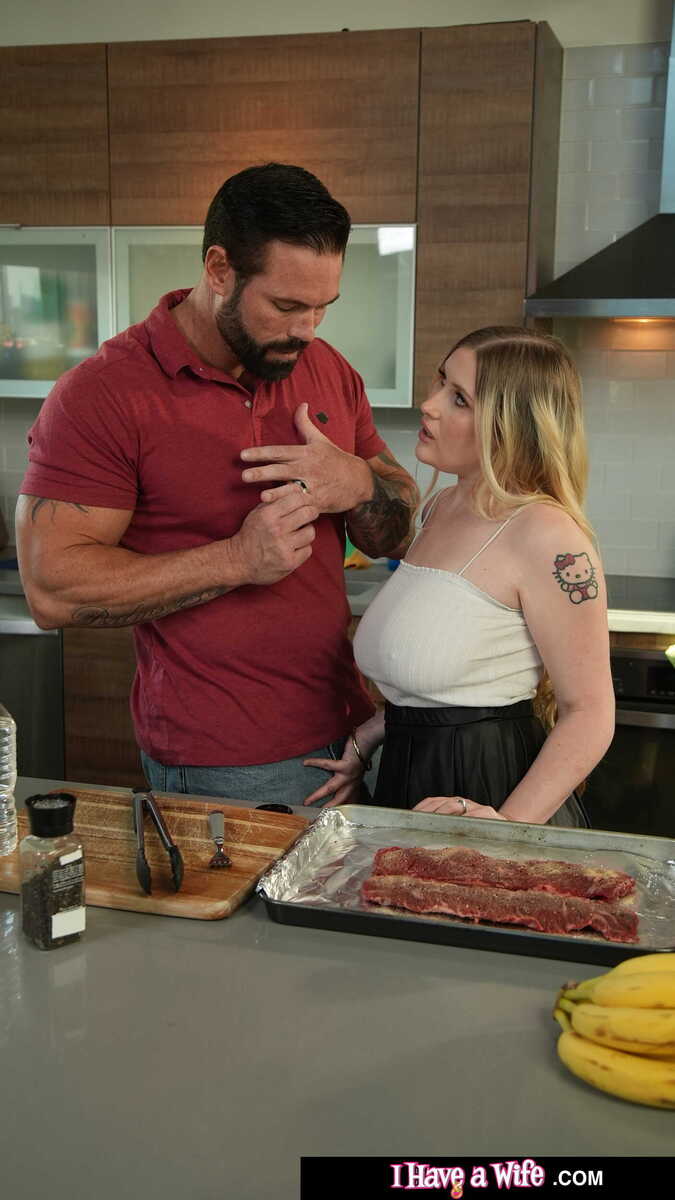 I Have a Wife Emma Shay porn scene 'Busty Blonde Emma Shay loves to work some big meat' - Emma Shay is cooking a steak with her husband in the kitchen.