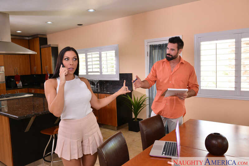 In the Rachel Starr I Have a Wife porn scene 'American Rachel Starr fucking in the bed with her brown eyes', Rachel Starr is talking on the phone while her husband is in the kitchen.