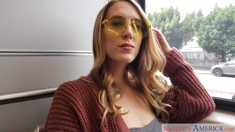 In the Cadence Lux LA Sluts porn scene 'LA Slut Cadence Lux Helps Herself To Some Big  Stranger Cock', Cadence Lux is wearing a sweater and heart-shaped sunglasses.