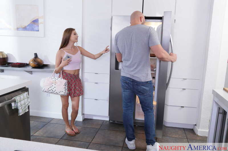 Scene from Naughty America Carolina Sweets porn video 'Carolina Sweets fucking in the counter with her tattoos' where Carolina Sweets is in the kitchen with her man.