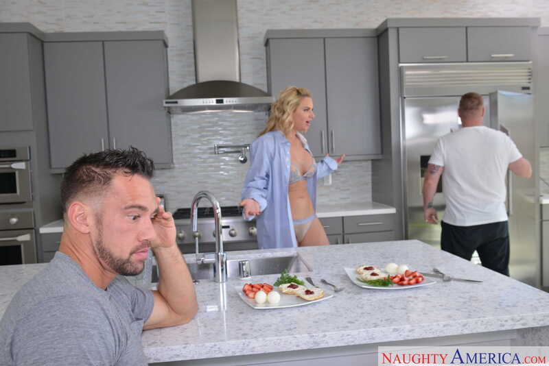 Naughty America Phoenix Marie porn: Phoenix Marie is in the kitchen with a man and a woman.