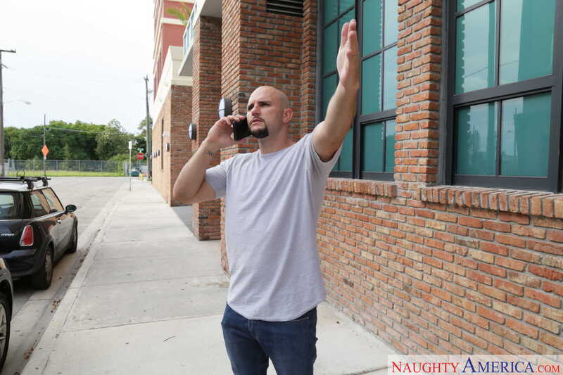 Naughty America Quinn Wilde porn: Quinn Wilde is talking on the phone while standing outside.