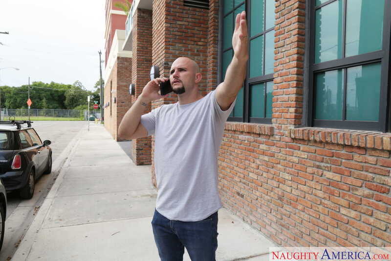 Naughty America Quinn Wilde porn: Quinn Wilde is talking on the phone while standing outside.