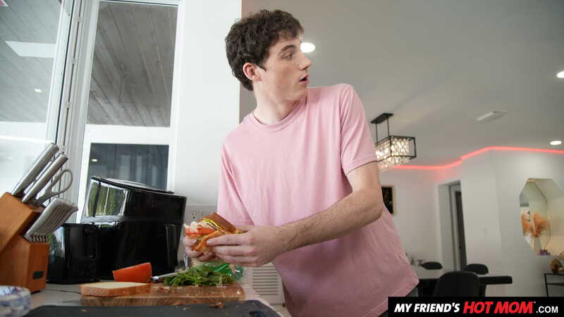 In the Katalina Kyle My Friend's Hot Mom porn scene 'Sexy Milf Katalina Kyle gets a cock meat sandwich from her son's friend', Katalina Kyle is making a sandwich in the kitchen.