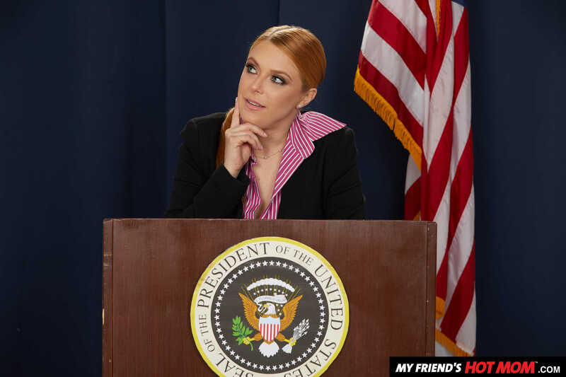 Naughty America Penny Pax porn: Penny Pax ton is standing behind a podium with the seal of the president on it.