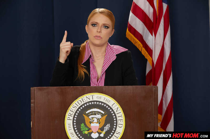 Scene from Naughty America Penny Pax porn video 'Penny Pax gives her intern a fuck of his life' where Penny Pax ton is pretending to be the president of the United States.