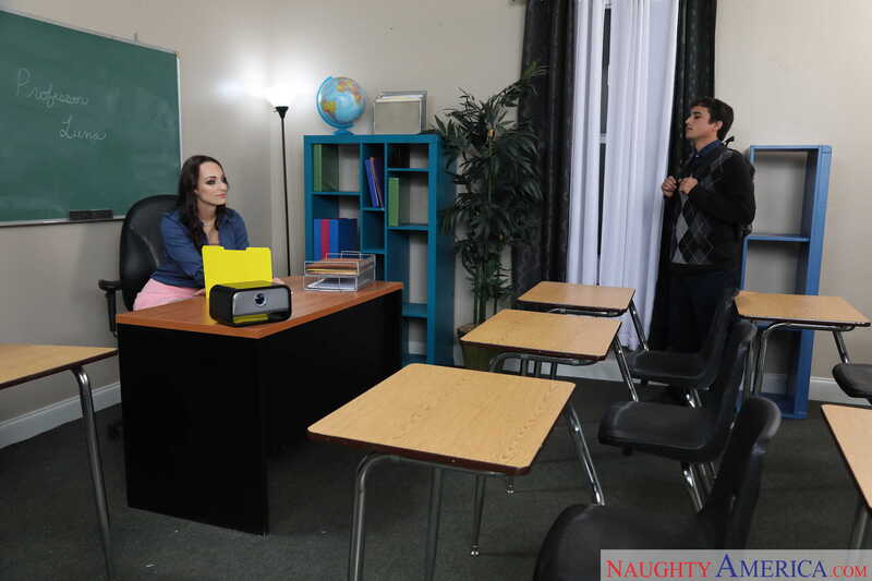 Scene from Naughty America Lexi Luna porn video 'Lexi Luna fucking in the classroom with her innie pussy' where Lexi Luna is a teacher in a classroom with a student.