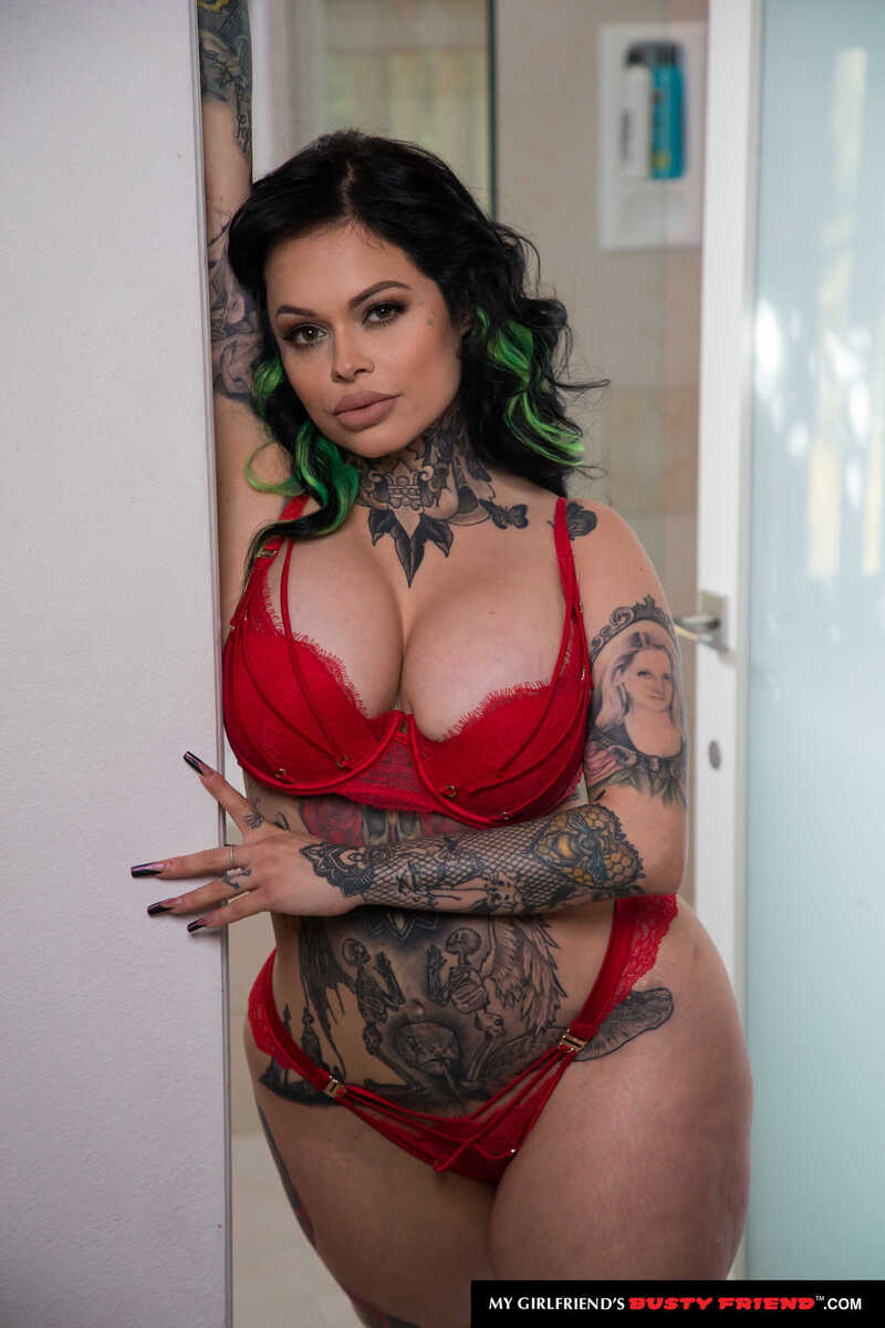 In the Xwife Karen My Girlfriend's Busty Friend porn scene 'Busty tattooed Latina Xwife Karen seduces her friend's man with her big tits', Xwife Karen is a sexy, tattooed model with a red bra and panties.