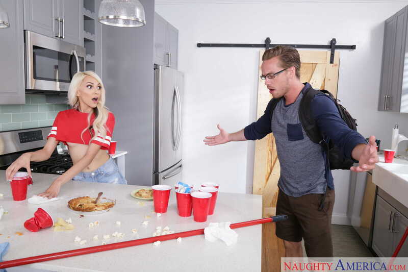 Scene from Naughty America Hime Marie porn video 'Hime Marie fucking in the chair with her small natural tits' where Hime Marie is in the kitchen with a pie and a man is trying to clean up.