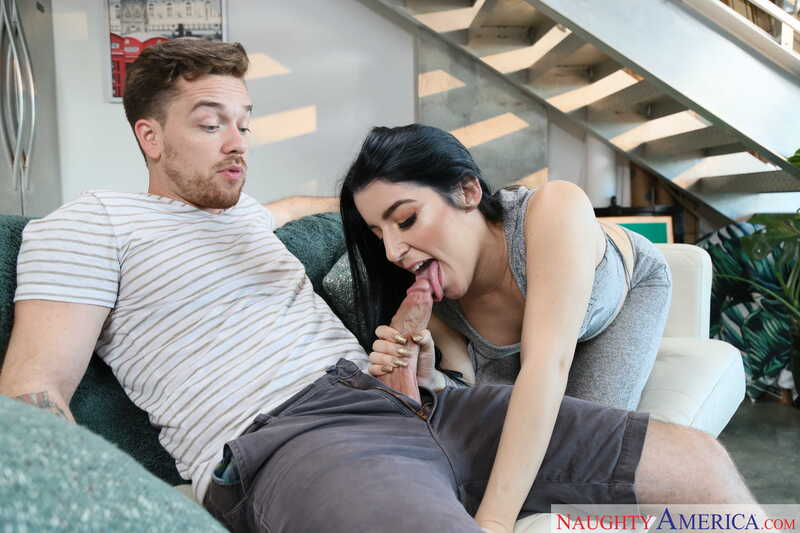 Naughty America Jessica Jewels porn: Jessica Jewels is giving a man a blowjob while sitting on a couch.