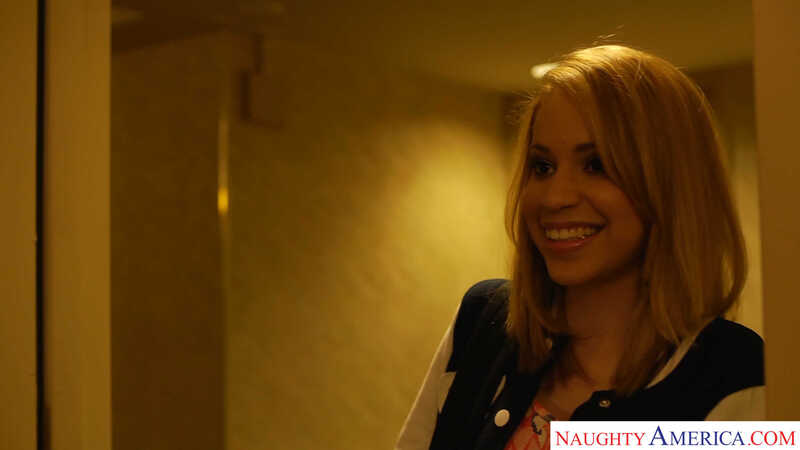 In the Mae Olsen Naughty America porn scene 'Mae Olsen Gets her money from her sugar daddy' from College Sugar Babes, Mae Olsen is smiling in a photo from Naughty America.com.