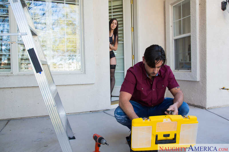 In the Alina Lopez Dirty Wives Club porn scene 'Wife Alina Lopez fucking in the bedroom with her innie pussy', Alina Lopez is standing behind a man who is working on a yellow toolbox.