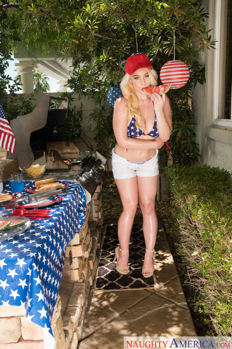 In the Hadley Mason Naughty America porn scene 'Hadley Viscara fucking in the bed with her natural tits', Hadley Mason is posing in a red hat and a patriotic outfit.