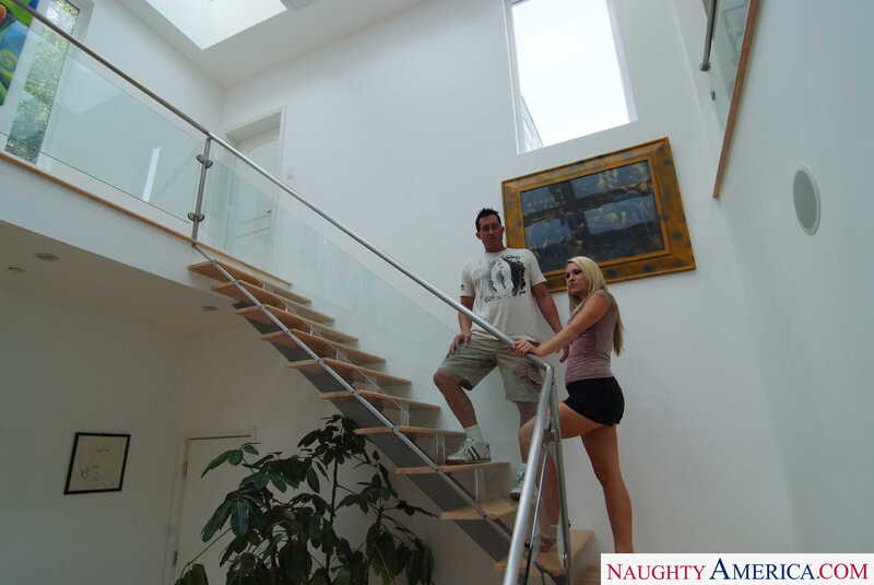 In the Harmony Naughty America porn scene 'All natural blonde Harmony takes horny neighbor's big cock', Harmony and disharmony in a modern house with a Naughty America.com watermark.