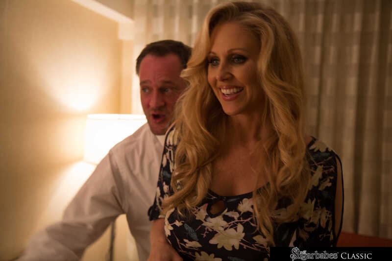 Milf Sugar Babes Julia Ann porn scene 'Julia Ann strips and fucks her sugar daddy before dinner' - Julia Ann and her man are in a hotel room.