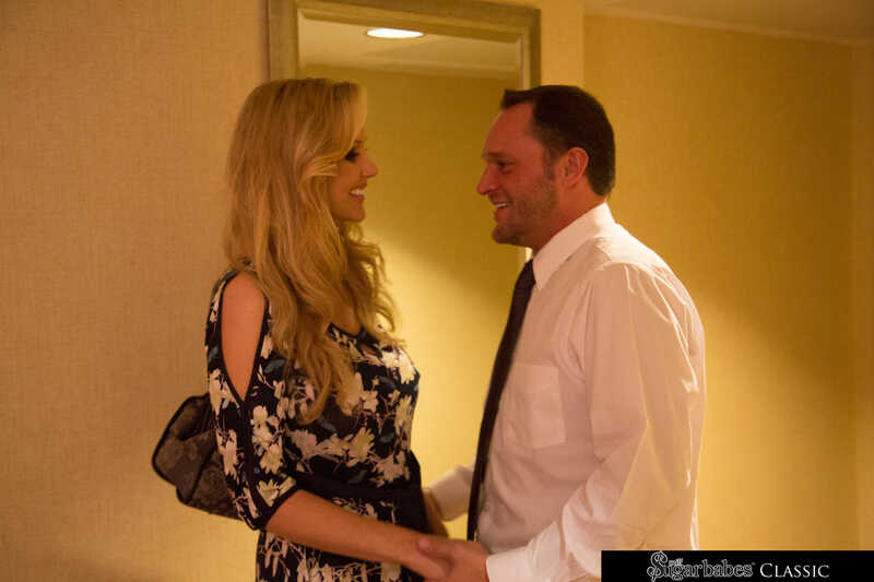 Naughty America Julia Ann porn: Julia Ann and her husband are smiling at each other.