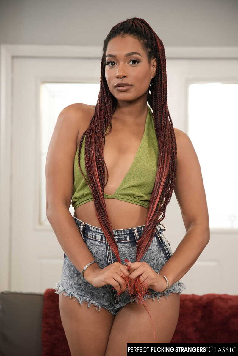 In the Addis Fouche Naughty America porn scene 'Sexy ebony Addis Fouche wants to test drive her roommates date' from Perfect Fucking Strangers, Addis Fouche is a sexy redhead with long braids and a green crop top.