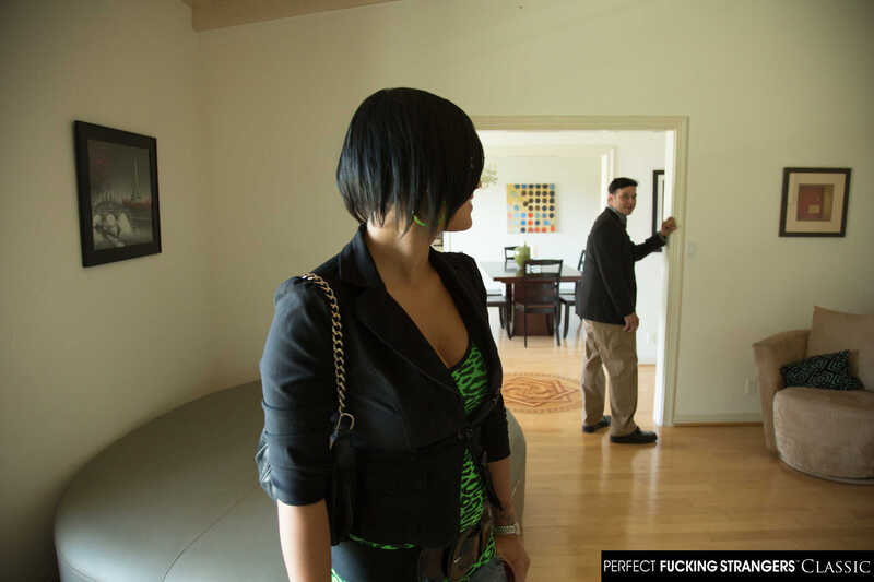 In the Eva Angelina Naughty America porn scene 'Eva Angelina fucks a stranger at an open house' from Perfect Fucking Strangers, Eva Angelina is in a  jacket and green shirt.