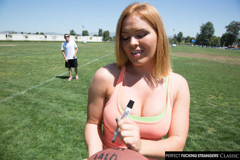 In the Krissy Lynn Naughty America porn scene 'Krissy Lynn gets her wet pussy fucked by a stranger' from Perfect Fucking Strangers, Krissy Lynn is signing a football for a fan.