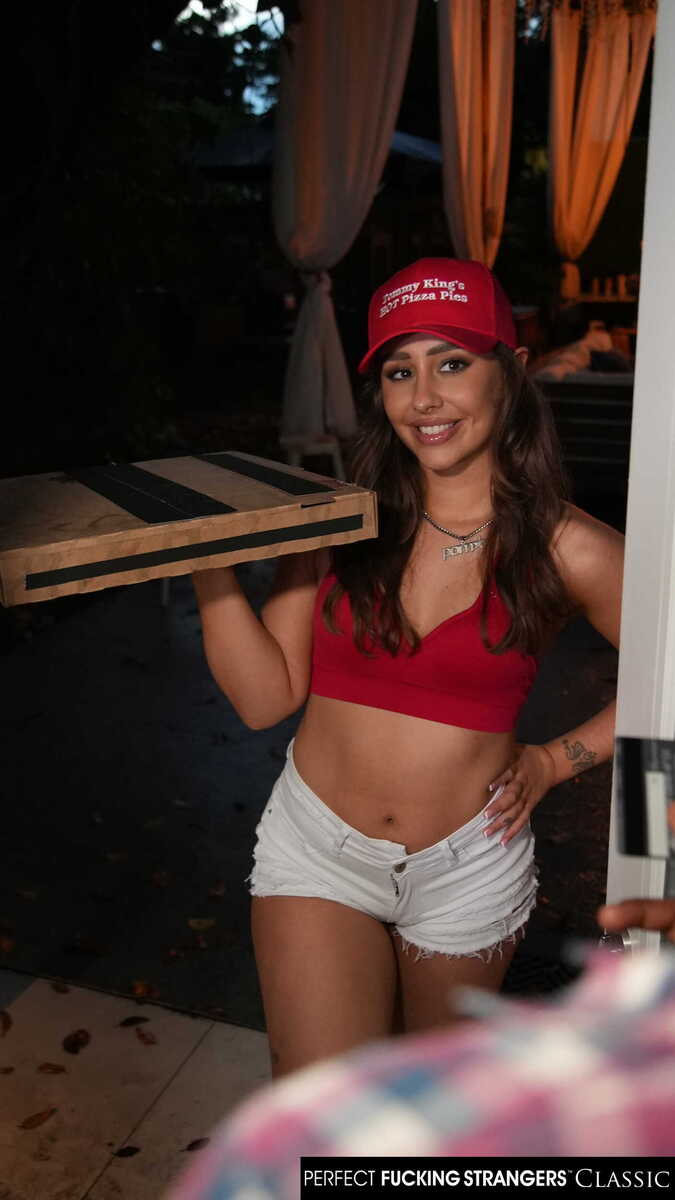 In the Tommy King Naughty America porn scene 'Big booty delivery girl Tommy King takes bbc instead of cash for pizza' from Perfect Fucking Strangers, Tommy King 's waitress is holding a tray and smiling.