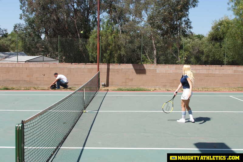 In the Kagney Linn Karter Naughty America porn scene 'Kagney Linn Karter serves up some outdoor fucking' from Naughty Athletics, Kagney Linn Karter is playing tennis on a court.