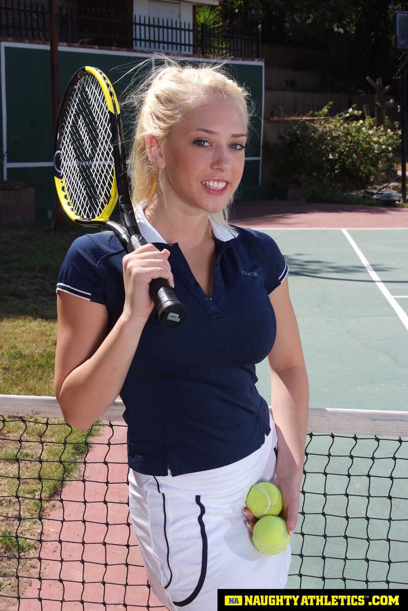 In the Kagney Linn Karter Naughty America porn scene 'Kagney Linn Karter serves up some outdoor fucking' from Naughty Athletics, Kagney Linn Karter is holding a tennis racket and balls.