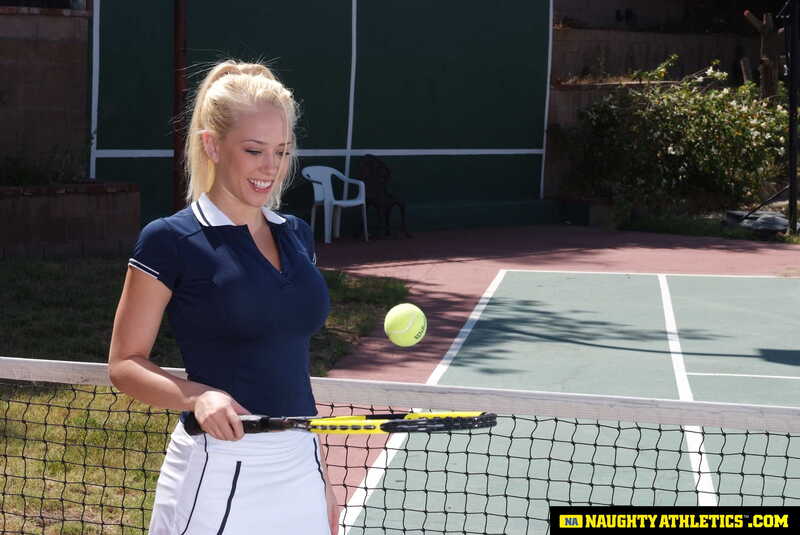 Naughty America Kagney Linn Karter porn: Kagney Linn Karter is playing tennis on a court.