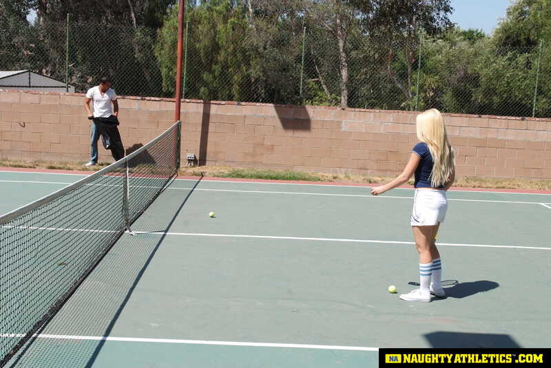 Naughty Athletics Kagney Linn Karter porn scene 'Kagney Linn Karter serves up some outdoor fucking' - Kagney Linn Karter is playing tennis on a court.