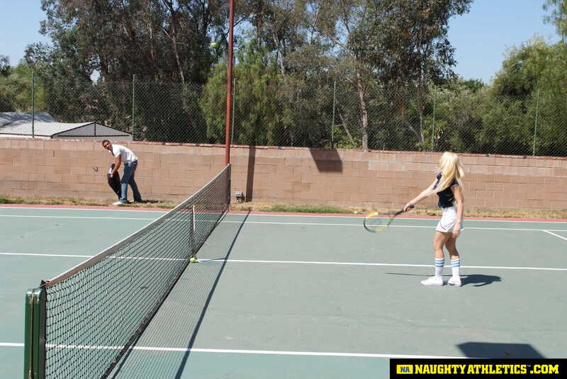 Naughty Athletics Kagney Linn Karter porn scene 'Kagney Linn Karter serves up some outdoor fucking' - Kagney Linn Karter is playing tennis on a court.