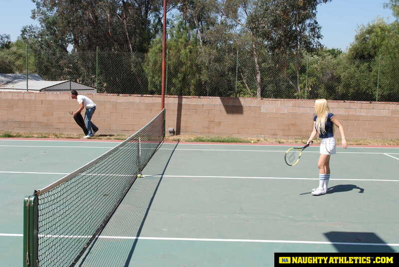 Scene from Naughty America Kagney Linn Karter porn video 'Kagney Linn Karter serves up some outdoor fucking' where Kagney Linn Karter is playing tennis on a court.