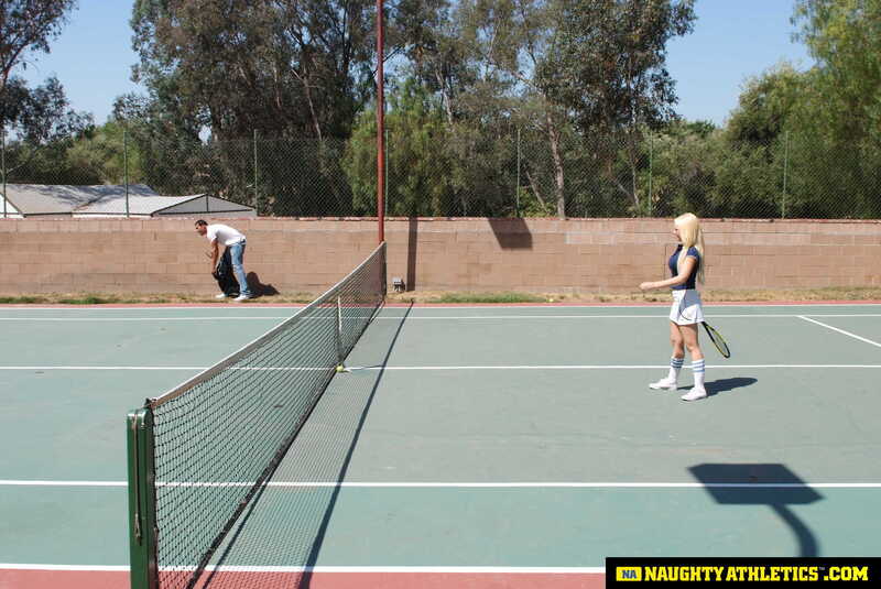 Scene from Naughty America Kagney Linn Karter porn video 'Kagney Linn Karter serves up some outdoor fucking' where Kagney Linn Karter is playing tennis on a court.