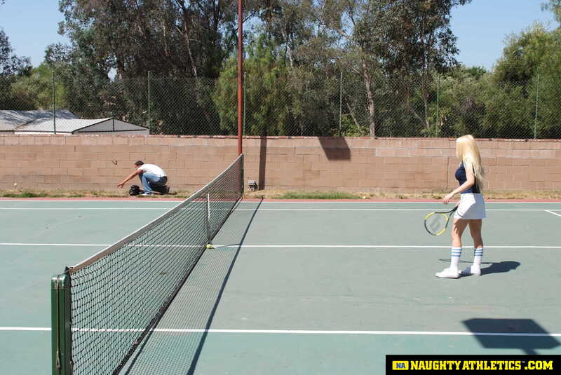 Scene from Naughty America Kagney Linn Karter porn video 'Kagney Linn Karter serves up some outdoor fucking' where Kagney Linn Karter is playing tennis on a court.