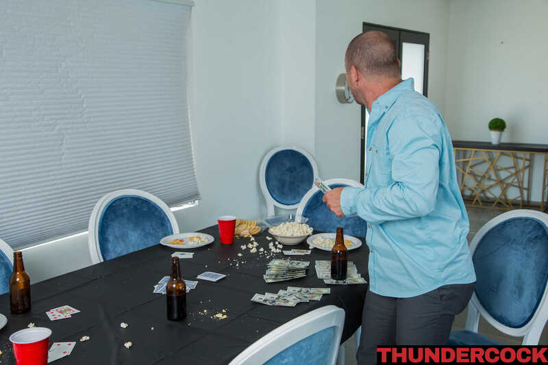 Thundercock Michele James porn scene 'Michelle James Fucks her boyfriend's Bully' - Michele James is playing cards with friends at a table.