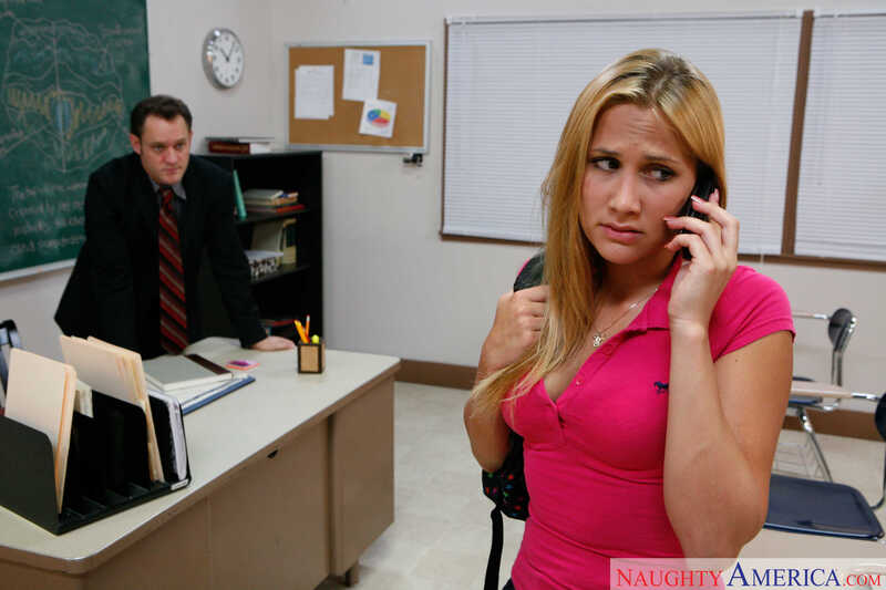 Naughty America Alanah Rae porn: Alanah Rae is on the phone in a classroom.