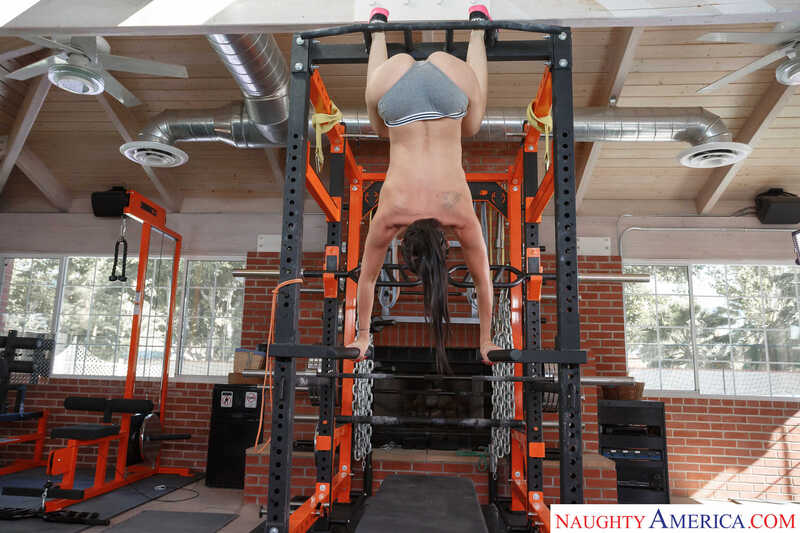 In the Rachel Starr Gym porn scene 'Hotness has arrived at the gym and Rachel Starr loves a good cardio FUCK to make her sweat', Rachel Starr is doing a handstand on a pull-up bar.