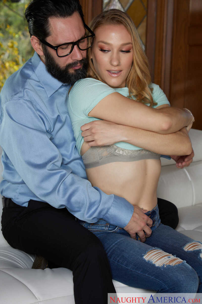 Naughty America Kasey Miller porn: Kasey Miller is getting her tits fondled by a man in a blue shirt.